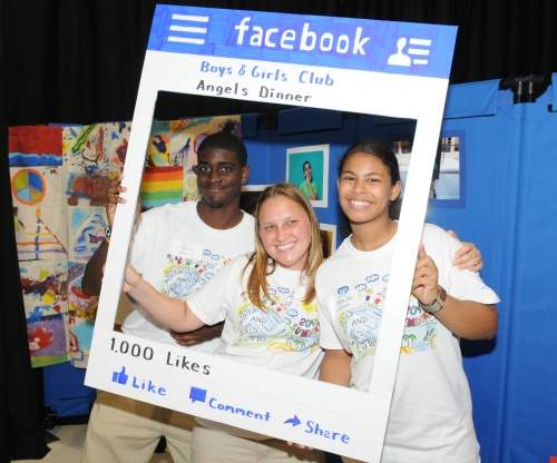 Three students in a Facebook poster frame